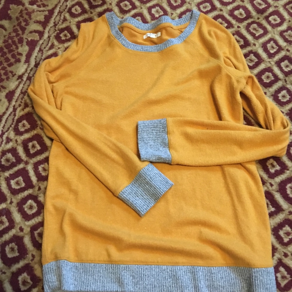 Mustard color top with gray trim
